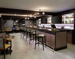 Hotel bar with lounge area perfect for co-working at DoubleTree By Hilton Montreal Airport.