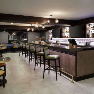 Hotel bar with lounge area perfect for co-working at DoubleTree By Hilton Montreal Airport.