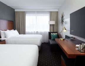 Day use Twin room with TV, work desk and private bathroom at DoubleTree By Hilton Montreal Airport.