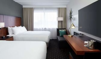 Day use Twin room with TV, work desk and private bathroom at DoubleTree By Hilton Montreal Airport.