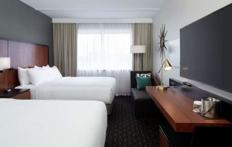 Day use Twin room with TV, work desk and private bathroom at DoubleTree By Hilton Montreal Airport.