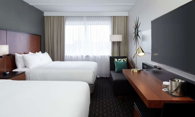 Day use Twin room with TV, work desk and private bathroom at DoubleTree By Hilton Montreal Airport.