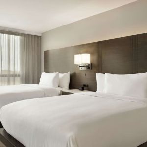 Twin room with private bathroom at the Embassy Suites by Hilton Montreal Airport.