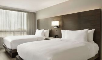 Twin room with private bathroom at the Embassy Suites by Hilton Montreal Airport.