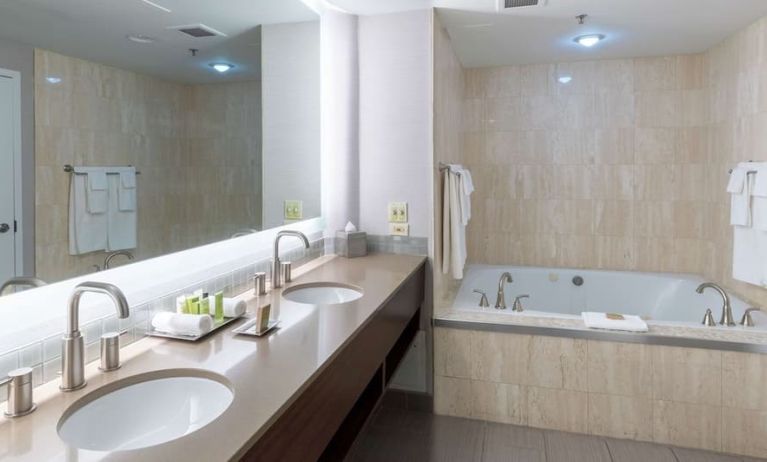 Private bathroom with tub and toiletries at the Hilton Saint John.