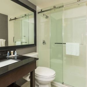 Guest bathroom with shower at Comfort Inn Sudbury East.