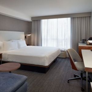 Day use room with work desk and sofa at Courtyard By Marriott Kitchener.