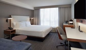 Day use room with work desk and sofa at Courtyard By Marriott Kitchener.