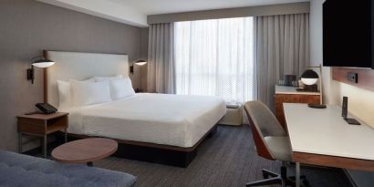 Day use room with work desk and sofa at Courtyard By Marriott Kitchener.