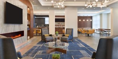 Lobby and coworking lounge at Courtyard By Marriott Kitchener.