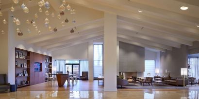 Hotel lobby with lounge area and workspace at Hilton Mississauga Meadowvale.