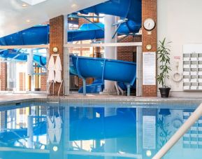 Indoor pool with spiral slide at Hilton Mississauga Meadowvale.