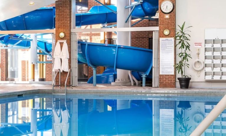 Indoor pool with spiral slide at Hilton Mississauga Meadowvale.