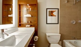 Private guest bathroom with shower and tub at Hilton Mississauga Meadowvale.