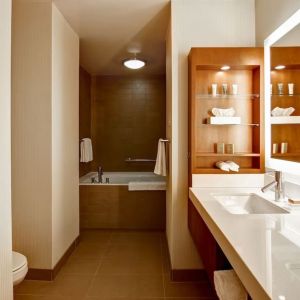 Private guest bathroom with tub and toiletries at Hilton Mississauga Meadowvale.