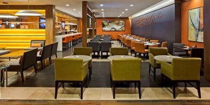 Dining area with comfortable seating at Hilton Mississauga Meadowvale.