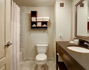 Private guest bathroom with tub at Hampton Inn By Hilton Toronto Airport Corporate Centre.