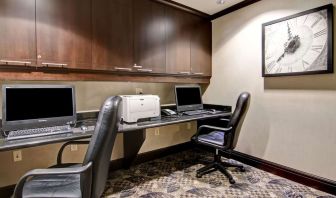 Business center with computers, printer and ergonomic chairs at Hampton Inn By Hilton Toronto Airport Corporate Centre.