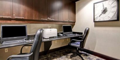 Business center with computers, printer and ergonomic chairs at Hampton Inn By Hilton Toronto Airport Corporate Centre.