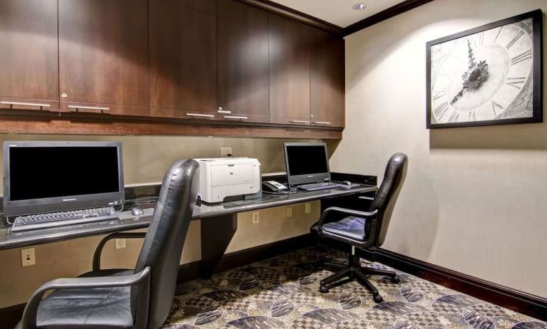 Business center with computers, printer and ergonomic chairs at Hampton Inn By Hilton Toronto Airport Corporate Centre.