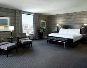 Day use room with work desk, lounge area and private bathroom at DoubleTree By Hilton Montreal.