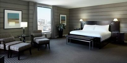 Day use room with work desk, lounge area and private bathroom at DoubleTree By Hilton Montreal.