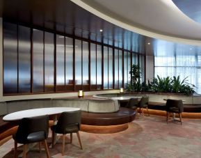 Dining area with comforatble seating, perfect for co-working at DoubleTree By Hilton Montreal.