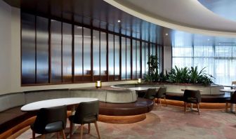 Dining area with comforatble seating, perfect for co-working at DoubleTree By Hilton Montreal.