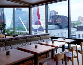 Dining area with comforatble seating, perfect for co-working at DoubleTree By Hilton Montreal.