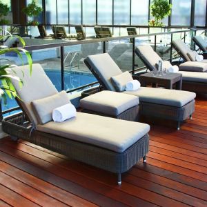 Relaxing indoor pool with lounge chairs at DoubleTree By Hilton Montreal.