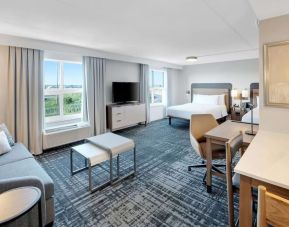 Twin day use room with lounge area and in-room kitchen at Homewood Suites By Hilton Toronto-Markham.