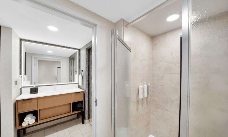 Private guest bathroom with shower and free toiletries at Homewood Suites By Hilton Toronto-Markham.