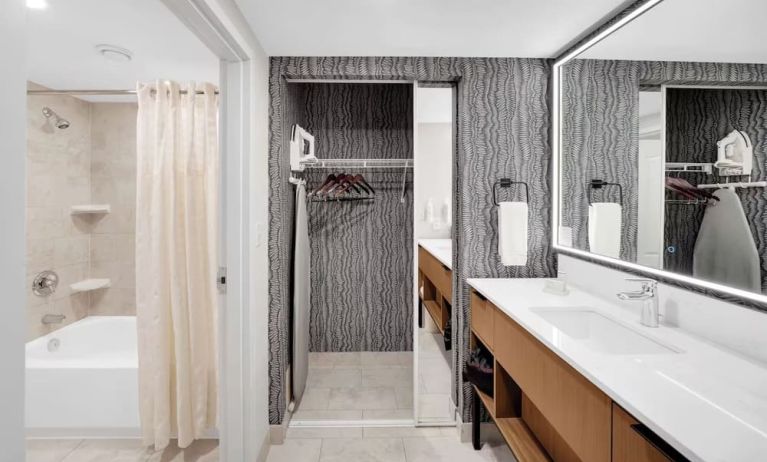 Private bathroom with tub, closet and free toiletries at Homewood Suites By Hilton Toronto-Markham.