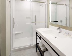 Private bathroom with shower at Hilton Garden Inn Montreal Midtown.