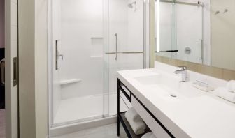 Private bathroom with shower at Hilton Garden Inn Montreal Midtown.