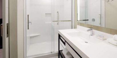 Private bathroom with shower at Hilton Garden Inn Montreal Midtown.