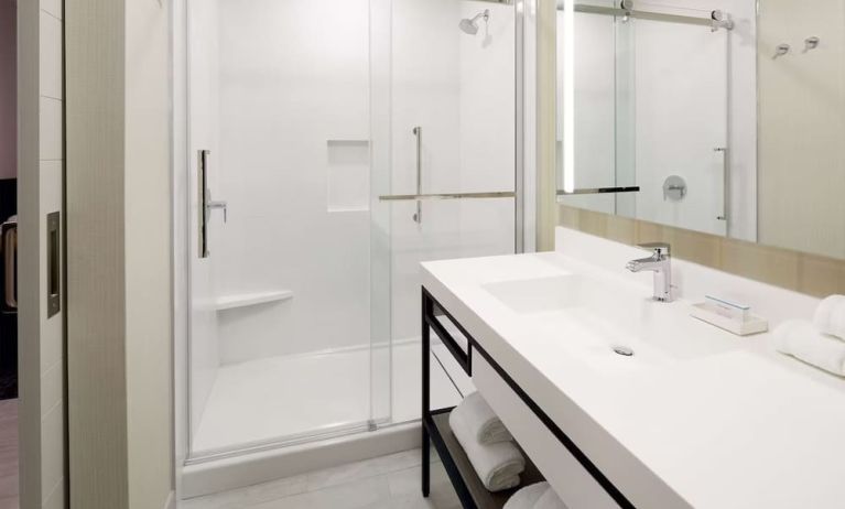 Private bathroom with shower at Hilton Garden Inn Montreal Midtown.