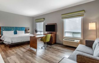 Day use studio suite with lounge area, work station and private bathroom at Hampton Inn & Suites By Hilton Edmonton/West.