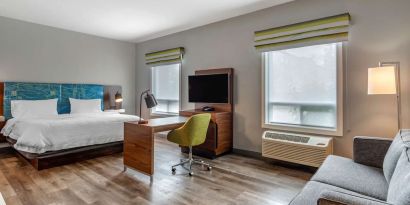 Day use studio suite with lounge area, work station and private bathroom at Hampton Inn & Suites By Hilton Edmonton/West.