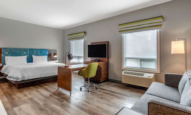 Day use studio suite with lounge area, work station and private bathroom at Hampton Inn & Suites By Hilton Edmonton/West.