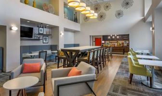 Hotel dining area with comfortable seating, perfect for co-working at Hampton Inn & Suites By Hilton Edmonton/West.