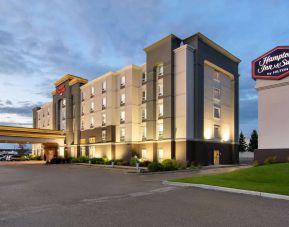 Hotel exterior and parking area at Hampton Inn & Suites By Hilton Edmonton/West.