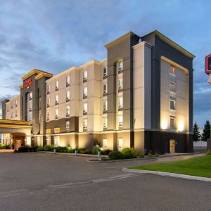 Hotel exterior and parking area at Hampton Inn & Suites By Hilton Edmonton/West.