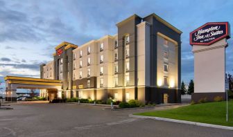 Hotel exterior and parking area at Hampton Inn & Suites By Hilton Edmonton/West.