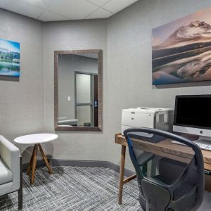 Business center with computer, printer, phone and comfortable mobiliary at Hampton Inn & Suites By Hilton Edmonton/West.