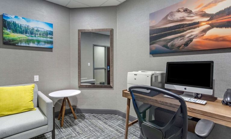 Business center with computer, printer, phone and comfortable mobiliary at Hampton Inn & Suites By Hilton Edmonton/West.