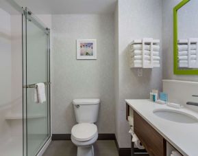 Private guest bathroom with shower and free toiletries at Hampton Inn & Suites By Hilton Edmonton/West.