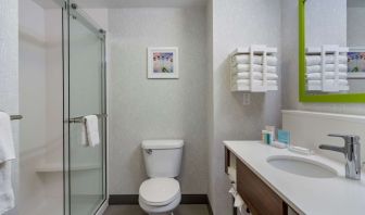 Private guest bathroom with shower and free toiletries at Hampton Inn & Suites By Hilton Edmonton/West.