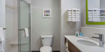 Private guest bathroom with shower and free toiletries at Hampton Inn & Suites By Hilton Edmonton/West.