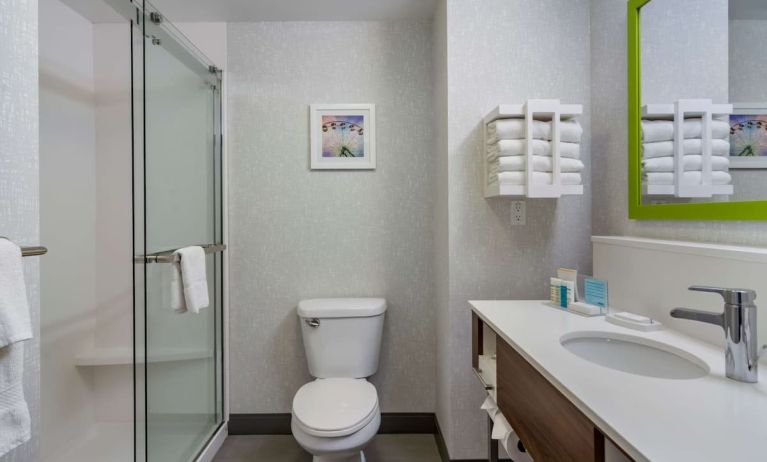 Private guest bathroom with shower and free toiletries at Hampton Inn & Suites By Hilton Edmonton/West.